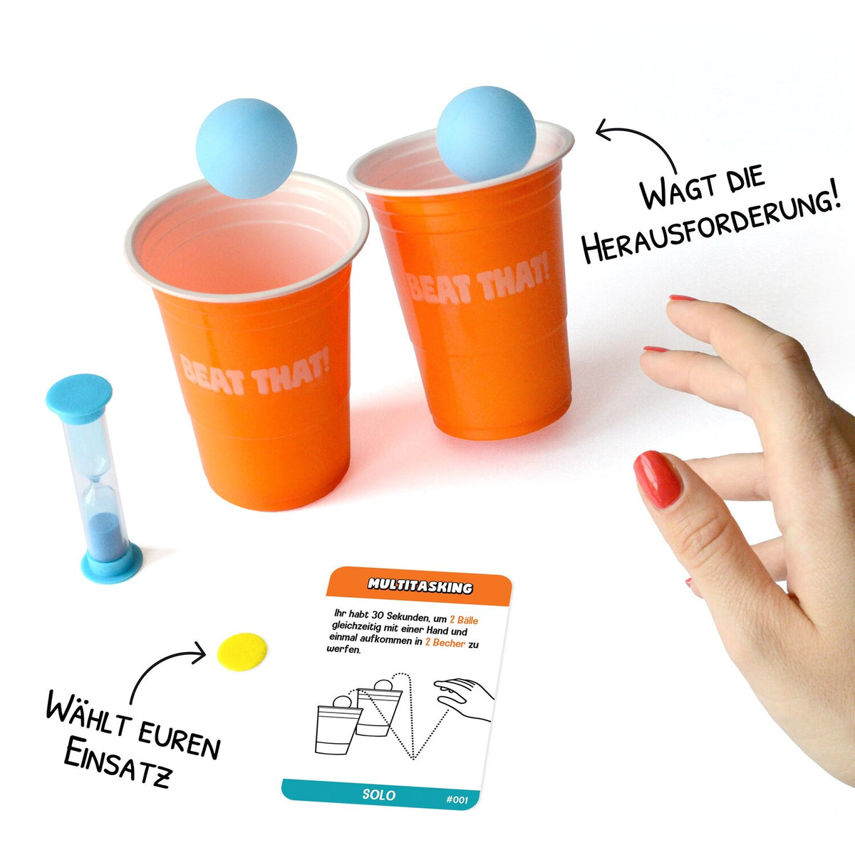 Orange Spielbecher mit blauen Kugeln und Auswahlkarte, Hand greift bereit