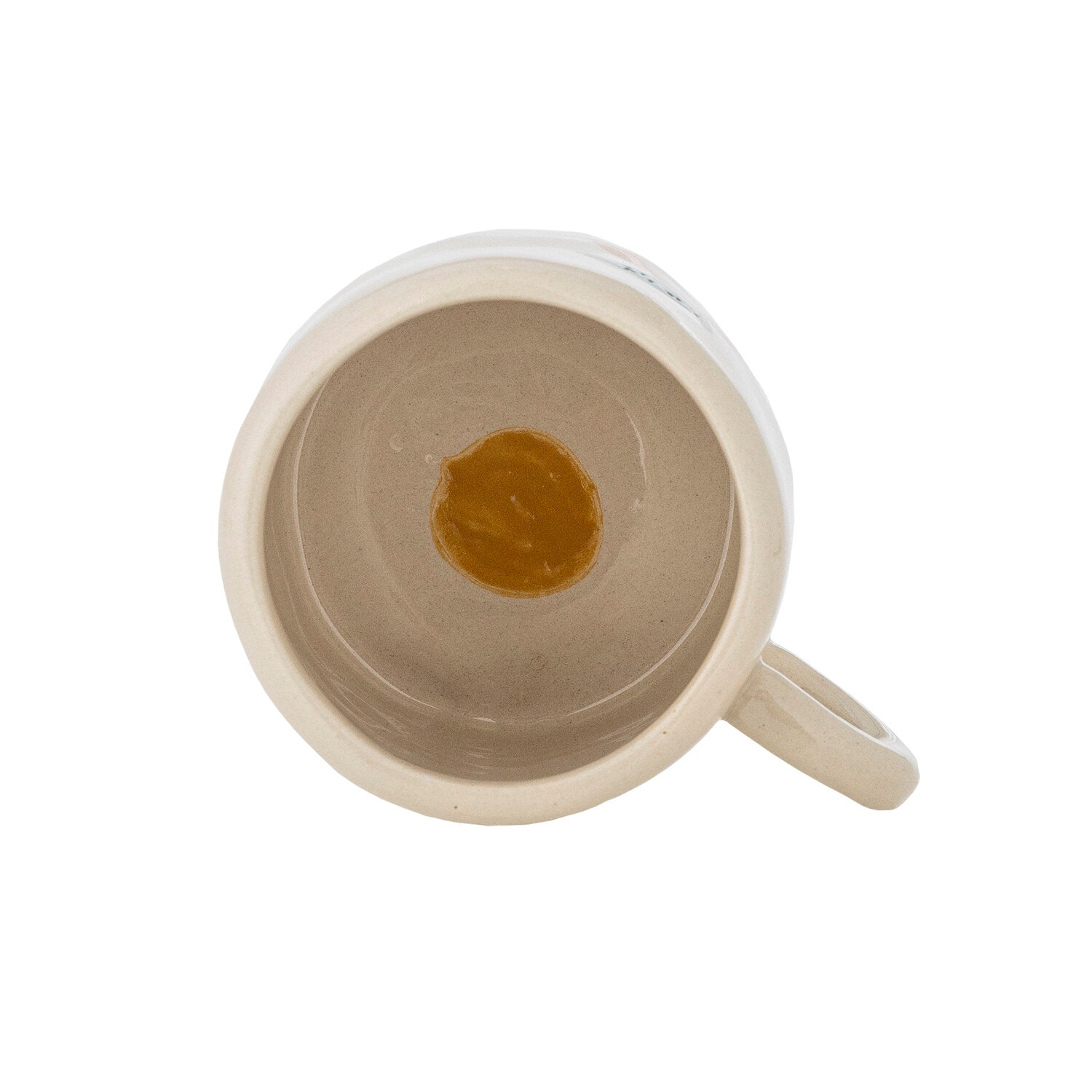 Cremefarbene Tasse von oben mit Innenfläche und seitlichem Henkel