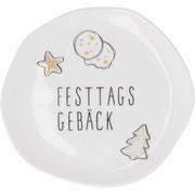 Kleiner weißer Teller mit „FESTTAGS GEBÄCK“-Schrift und Gebäck-Illustrationen
