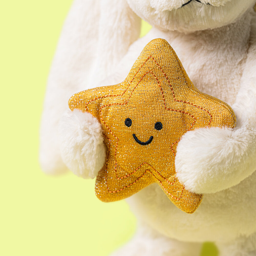 Kuscheltier Hase mit goldfarbenem Stern mit Smiley-Gesicht, beiger Plüsch