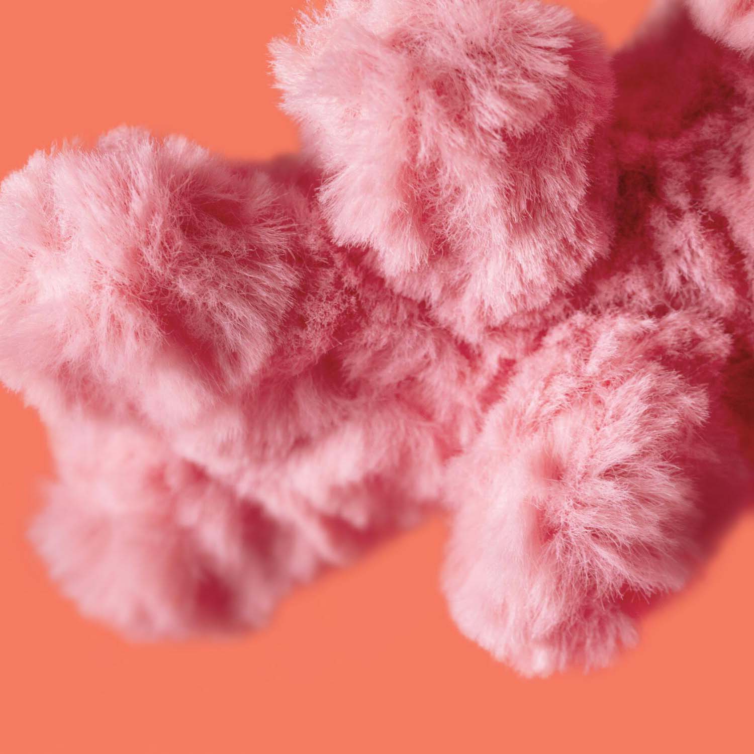 Kuscheltier Koralle „Amuseables“: flauschige pinke Felloptik in Detailansicht