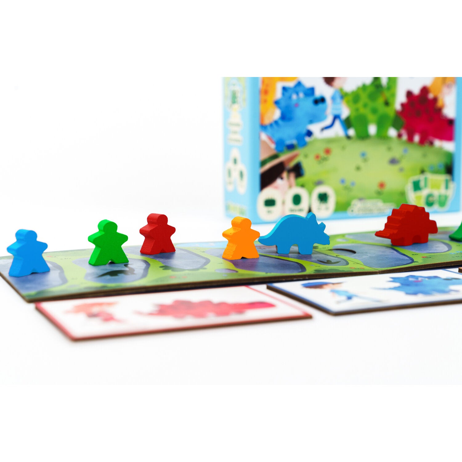 BalaDino Brettspiel mit bunten Dino-Figuren und Karten auf dem Spielbrett