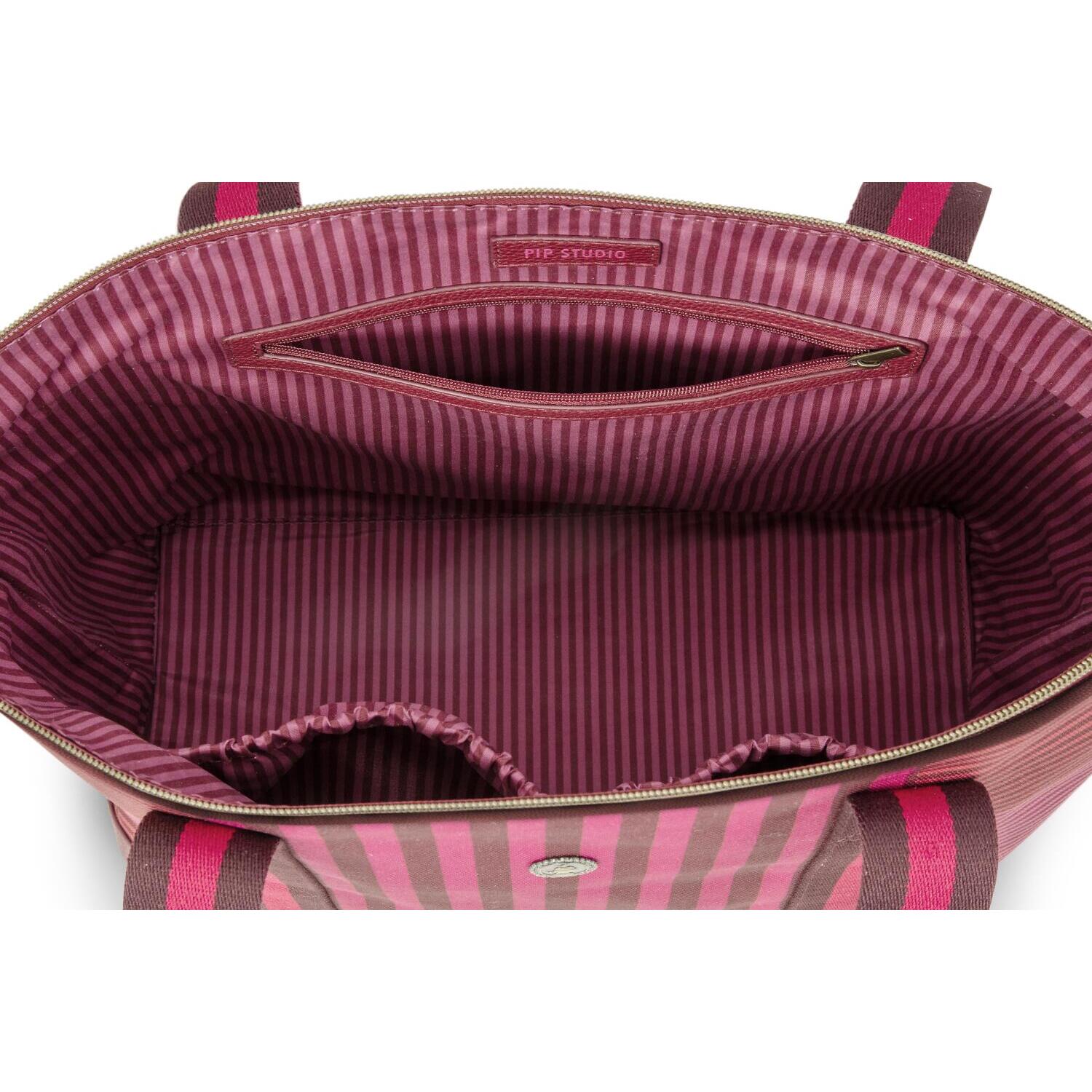 Geöffnete gestreifte Tragetasche: Innenfutter pink/dunkel mit Reißverschlussfach