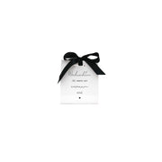 Weiße Mini-Geschenktüte mit schwarzer Schleife und Aufdruck „Weihnachten ist, wenn wir zusammen sind.“
